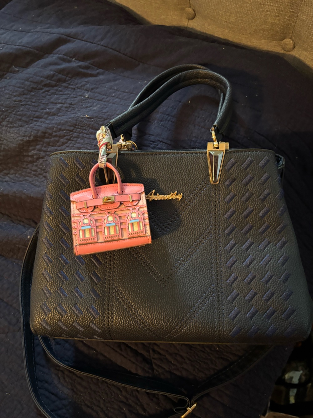 Navy bag with charms